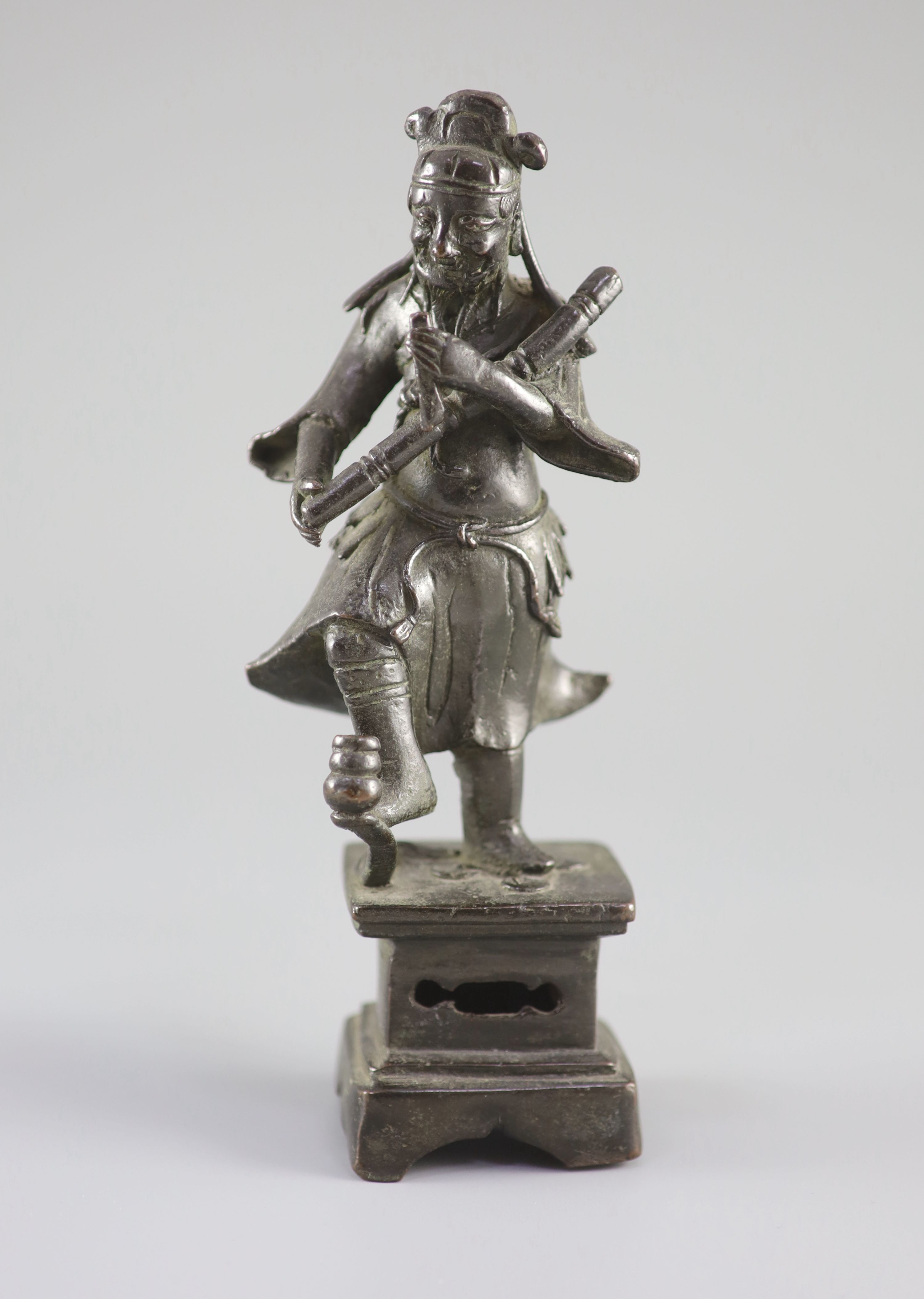 A Chinese bronze figure of an immortal, late Ming dynasty, 23 cm high